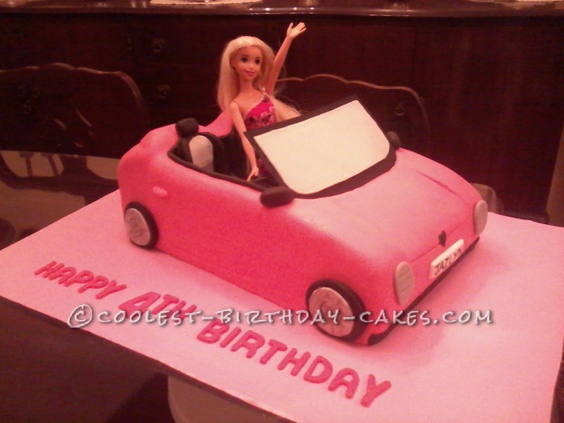 little girl driving barbie car